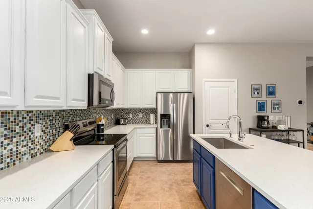 a kitchen with a sink a stove and refrigerator