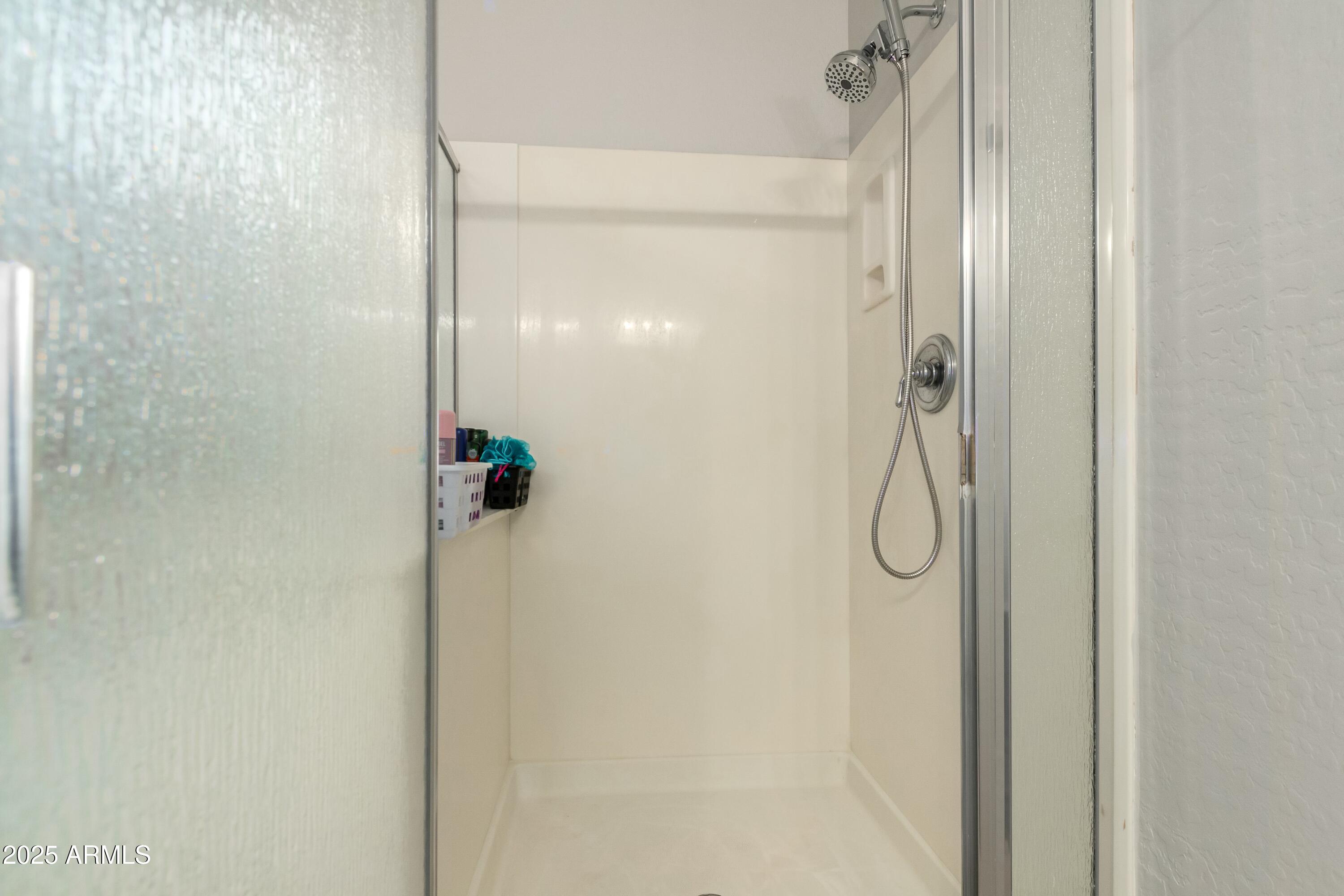 3419 West Zuni Brave Trail Phoenix, AZ 85086 - Photo 22 of 51 a bathroom with a shower