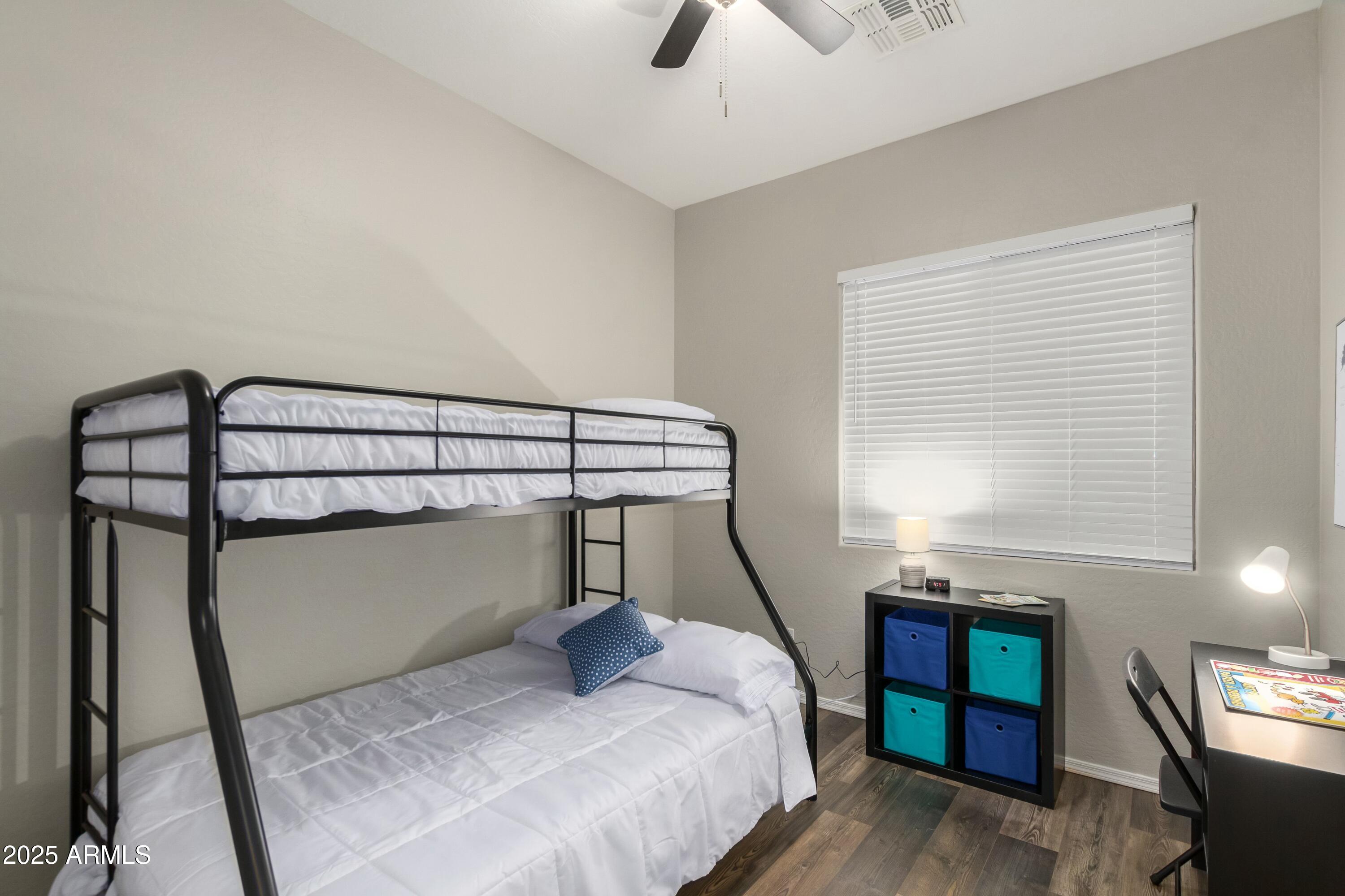 3419 West Zuni Brave Trail Phoenix, AZ 85086 - Photo 25 of 51 a bedroom with a bed and a window