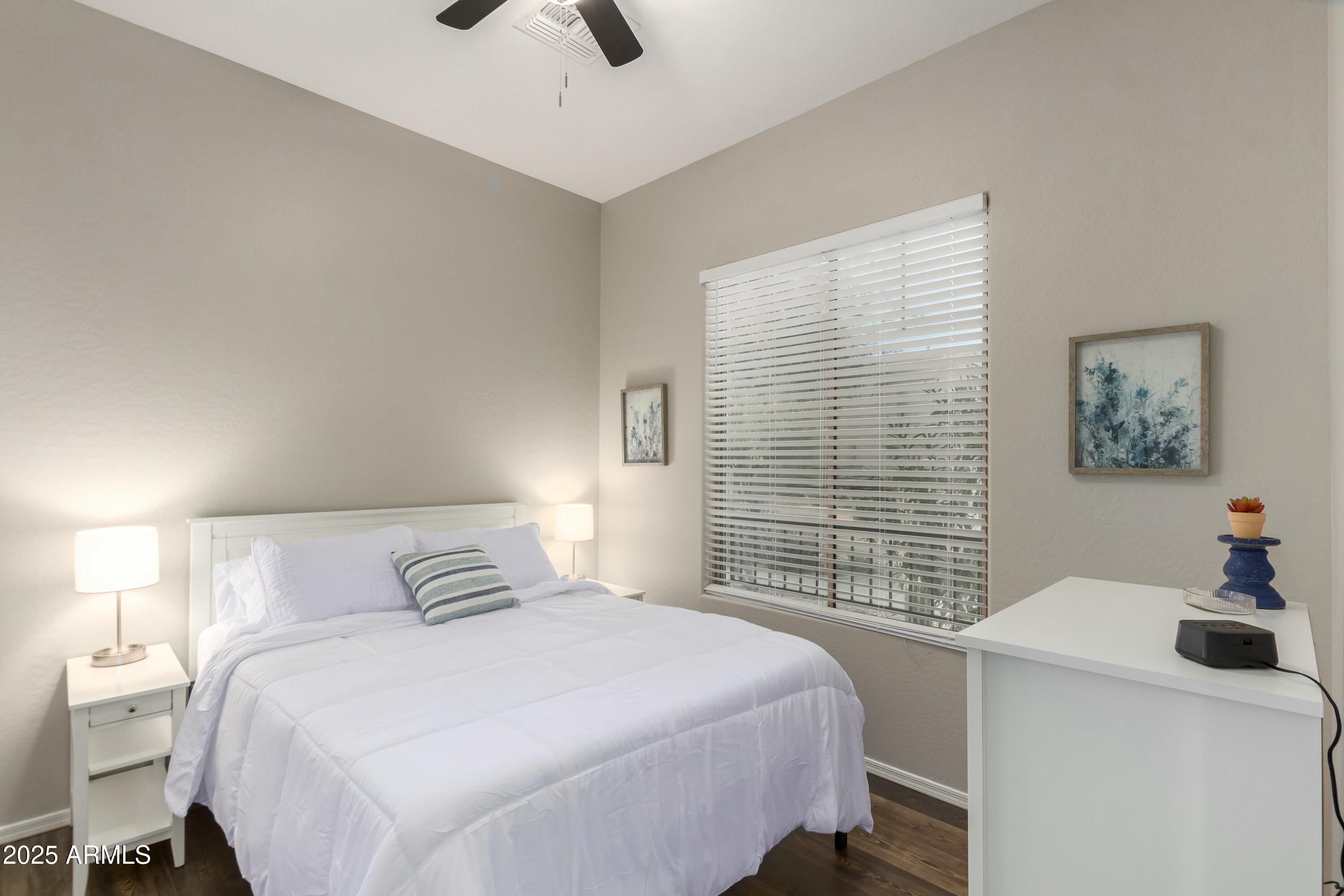 3419 West Zuni Brave Trail Phoenix, AZ 85086 - Photo 26 of 51 a bedroom with a bed and a window