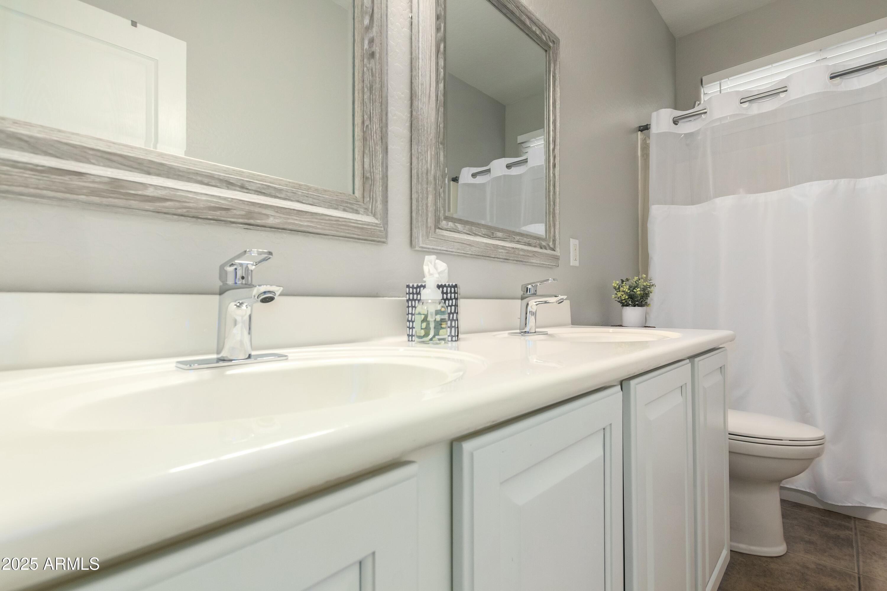 3419 West Zuni Brave Trail Phoenix, AZ 85086 - Photo 27 of 51 a bathroom with a sink and a toilet