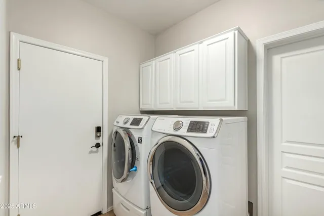 a view of empty room with wooden floor and windows