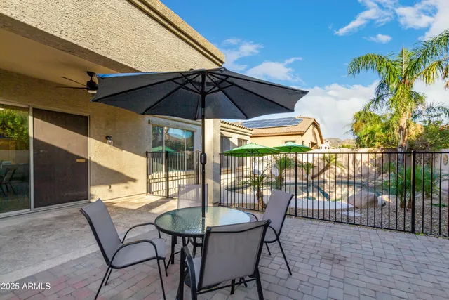 a view of a swimming pool with a patio