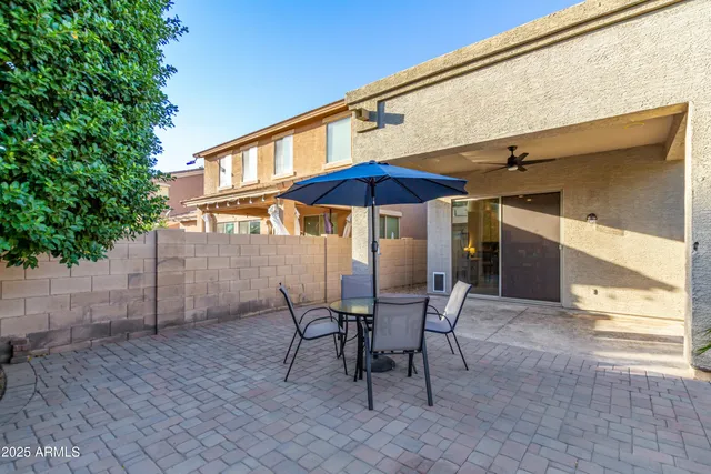 a view of a swimming pool with a patio