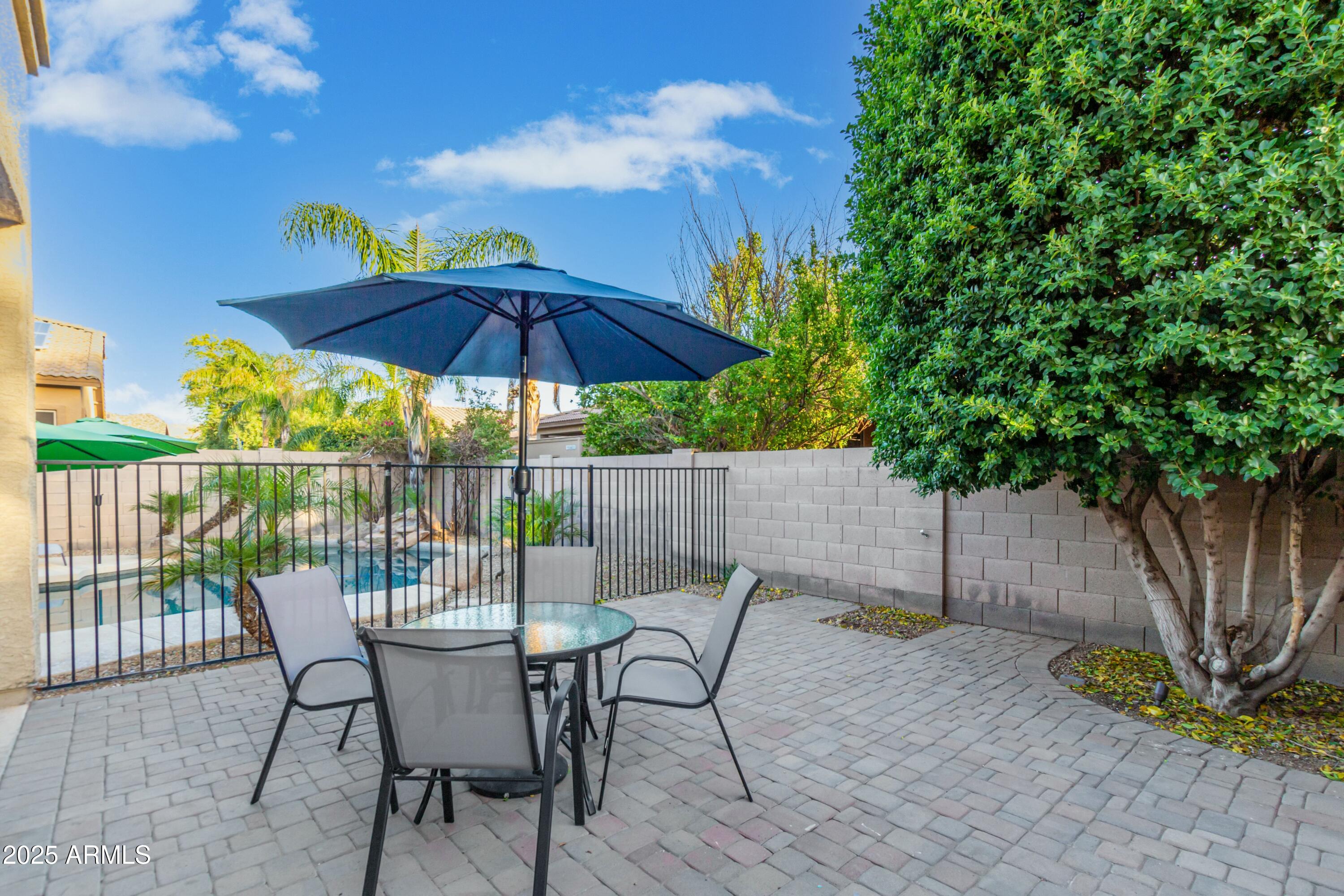 3419 West Zuni Brave Trail Phoenix, AZ 85086 - Photo 39 of 51 a view of a chair and table in the patio