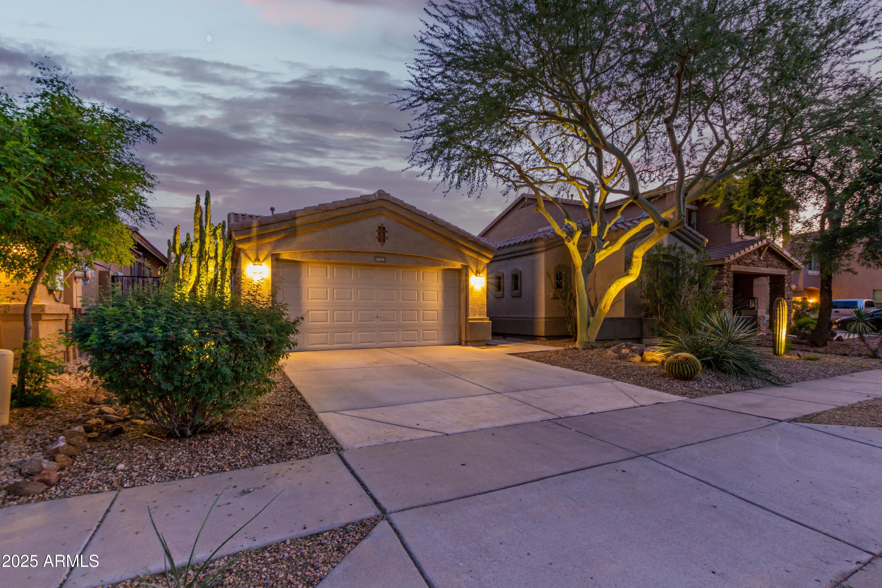 3419 West Zuni Brave Trail Phoenix, AZ 85086 - Photo 40 of 51 a view of a house with a yard and tree s