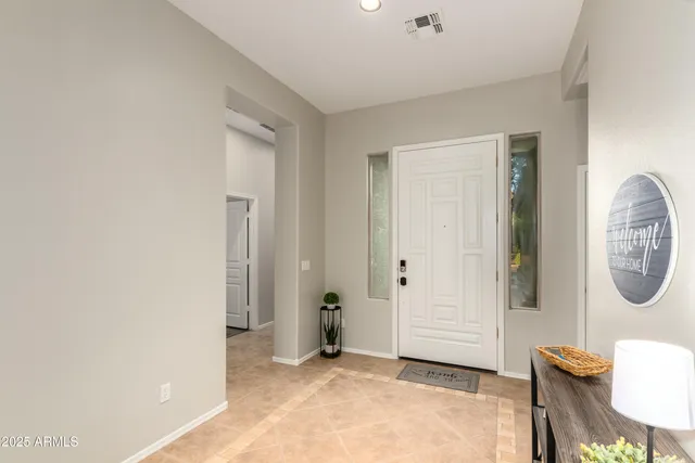 a view of a livingroom with furniture and a window