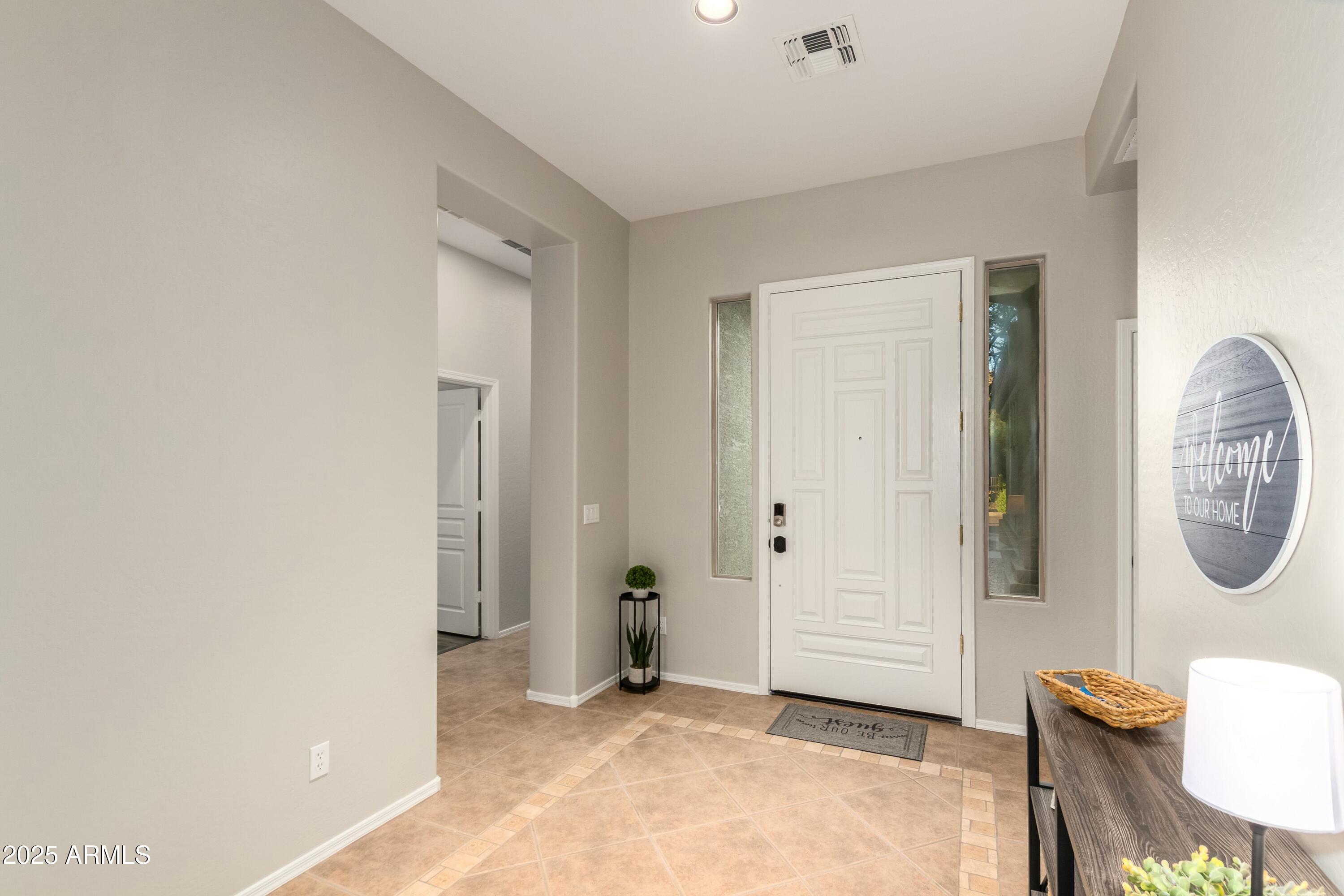 3419 West Zuni Brave Trail Phoenix, AZ 85086 - Photo 4 of 51 a view of a livingroom with furniture and a window
