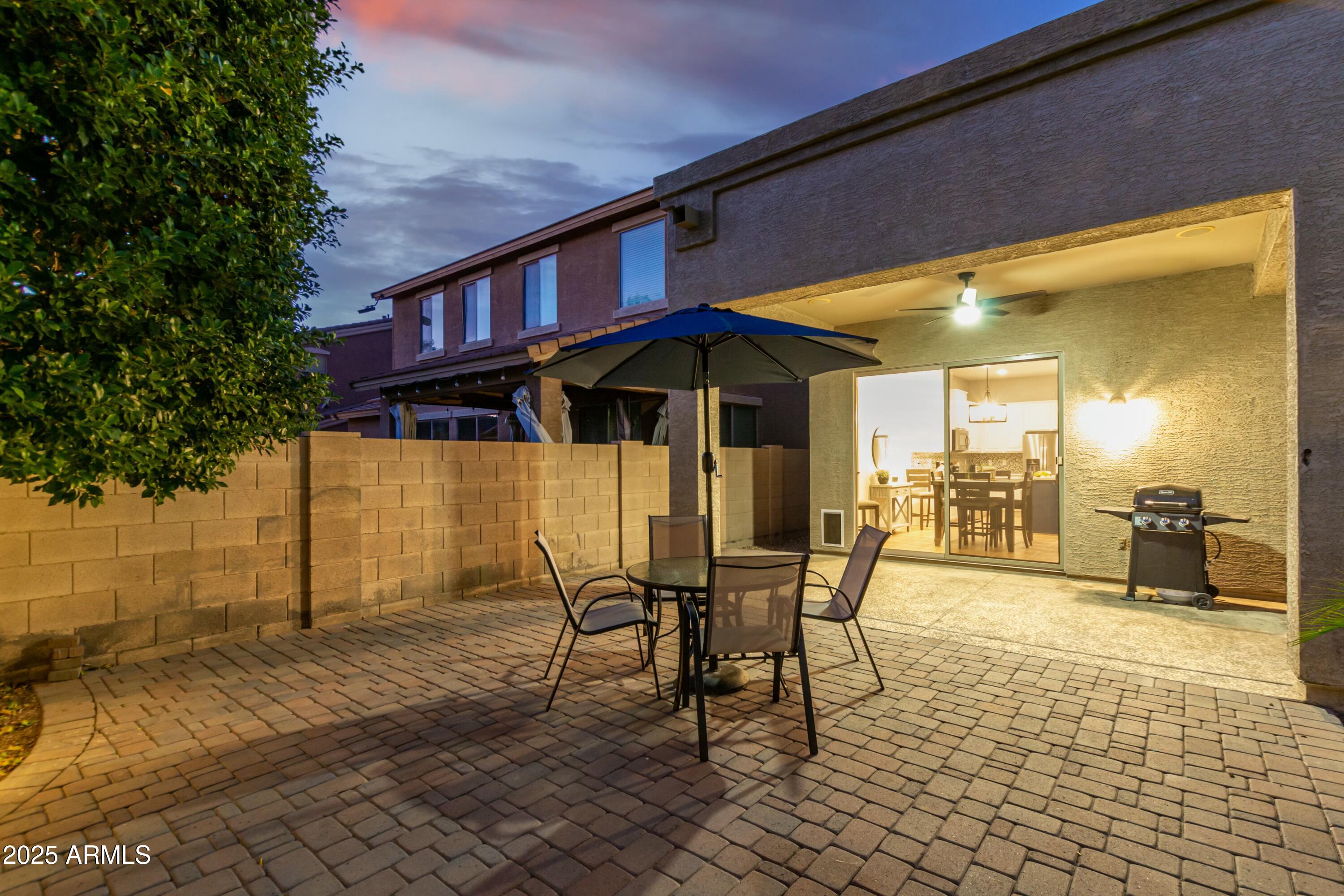 3419 West Zuni Brave Trail Phoenix, AZ 85086 - Photo 44 of 51 a patio with table and chairs