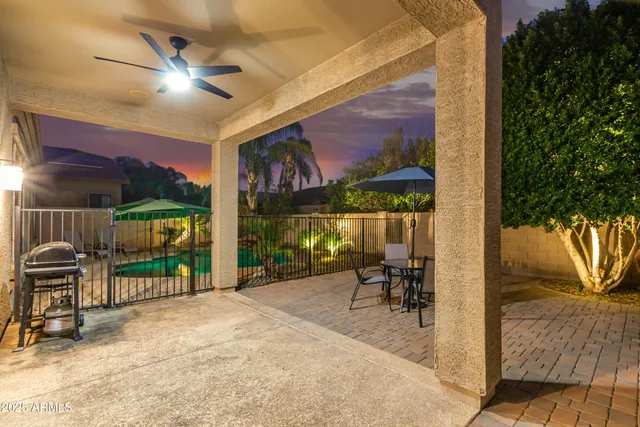 a view of a chairs and table in the patio