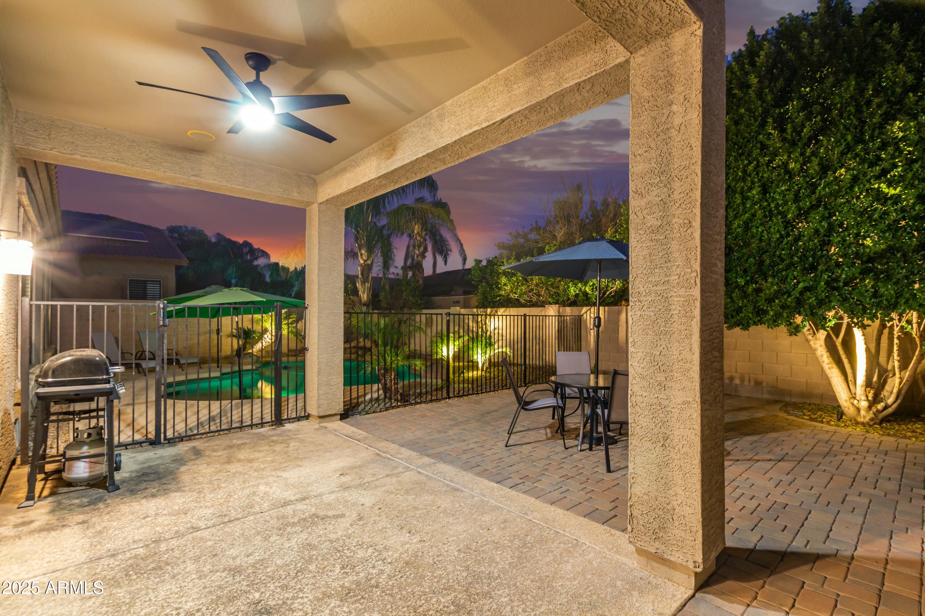 3419 West Zuni Brave Trail Phoenix, AZ 85086 - Photo 50 of 51 a view of a patio with a table and chairs