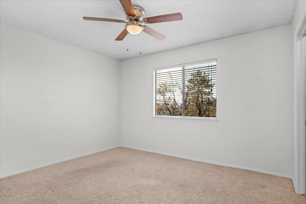 28340 Tollhouse Road Tollhouse, CA 93667 - Photo 12 of 37 an empty room with a window and a fan
