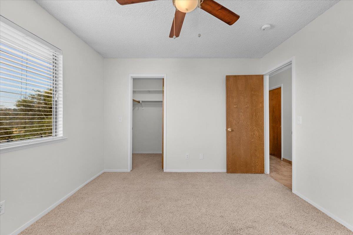 28340 Tollhouse Road Tollhouse, CA 93667 - Photo 13 of 37 an empty room with ceiling fan and window