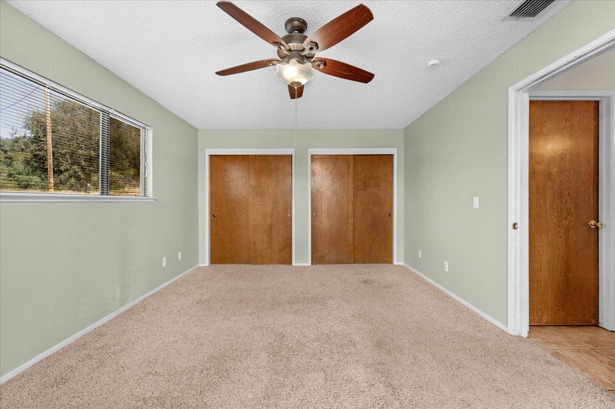 28340 Tollhouse Road Tollhouse, CA 93667 - Photo 16 of 37 an empty room with windows and fan