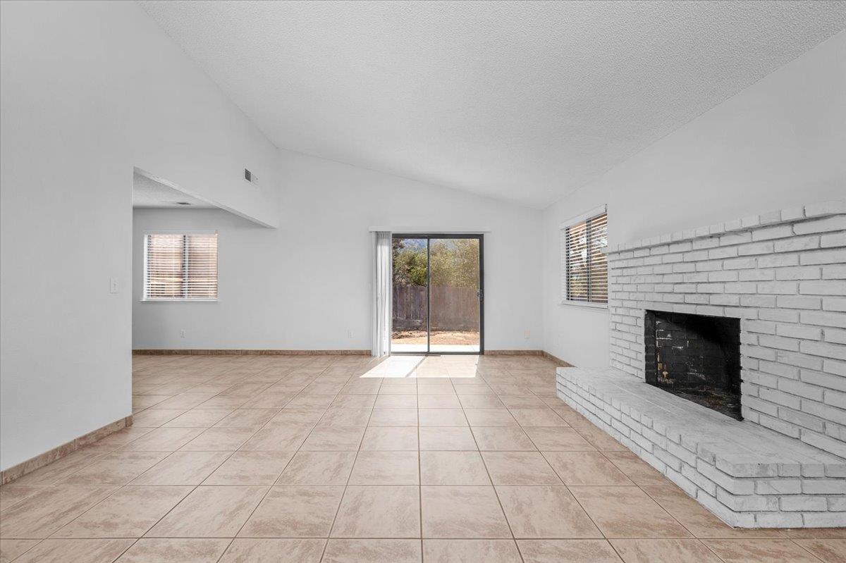 28340 Tollhouse Road Tollhouse, CA 93667 - Photo 3 of 37 a view of an empty room with window and fire place