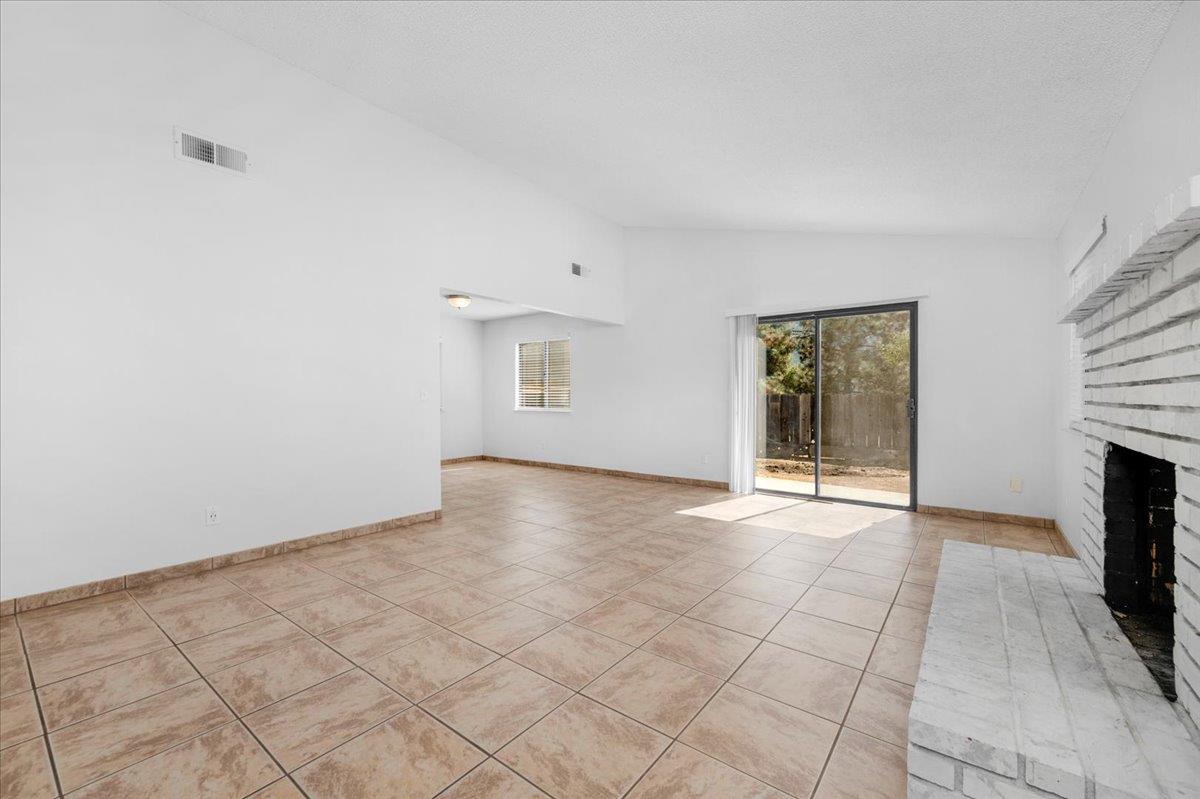 28340 Tollhouse Road Tollhouse, CA 93667 - Photo 4 of 37 an empty room with windows and fireplace
