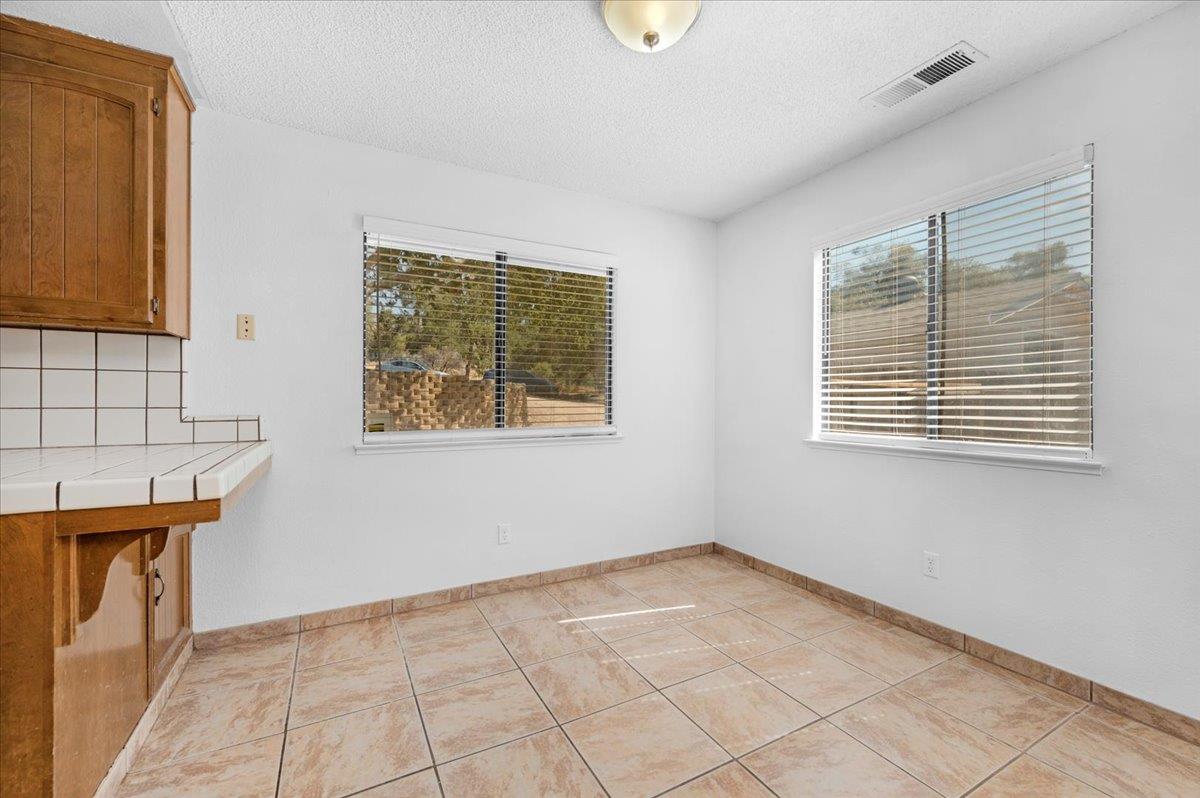 28340 Tollhouse Road Tollhouse, CA 93667 - Photo 5 of 37 an empty room with windows