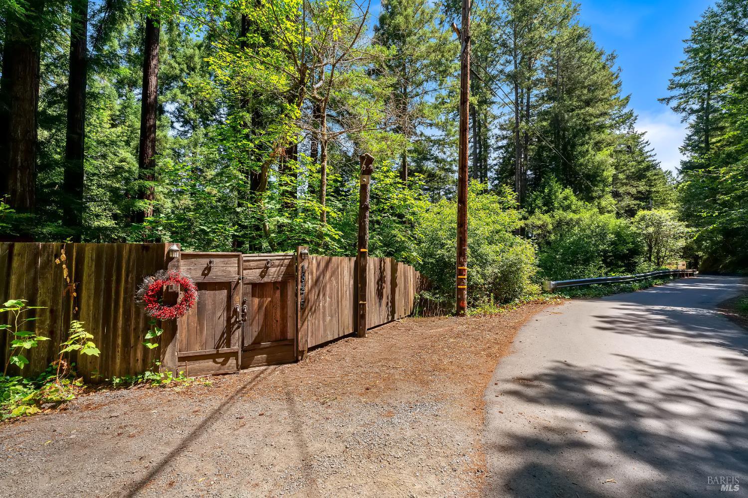 18475 Old Monte Rio Road Guerneville, CA 95446 - Photo 38 of 64 Fenced front gate with a lot of parking space