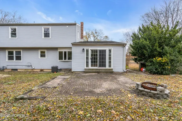 a view of a house with a yard and garage