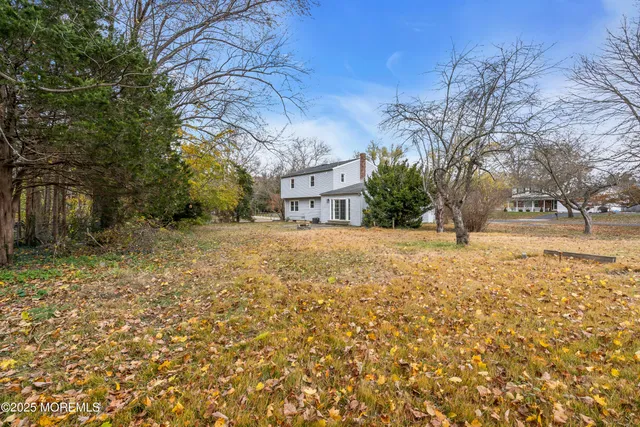 a view of house with snow on the road