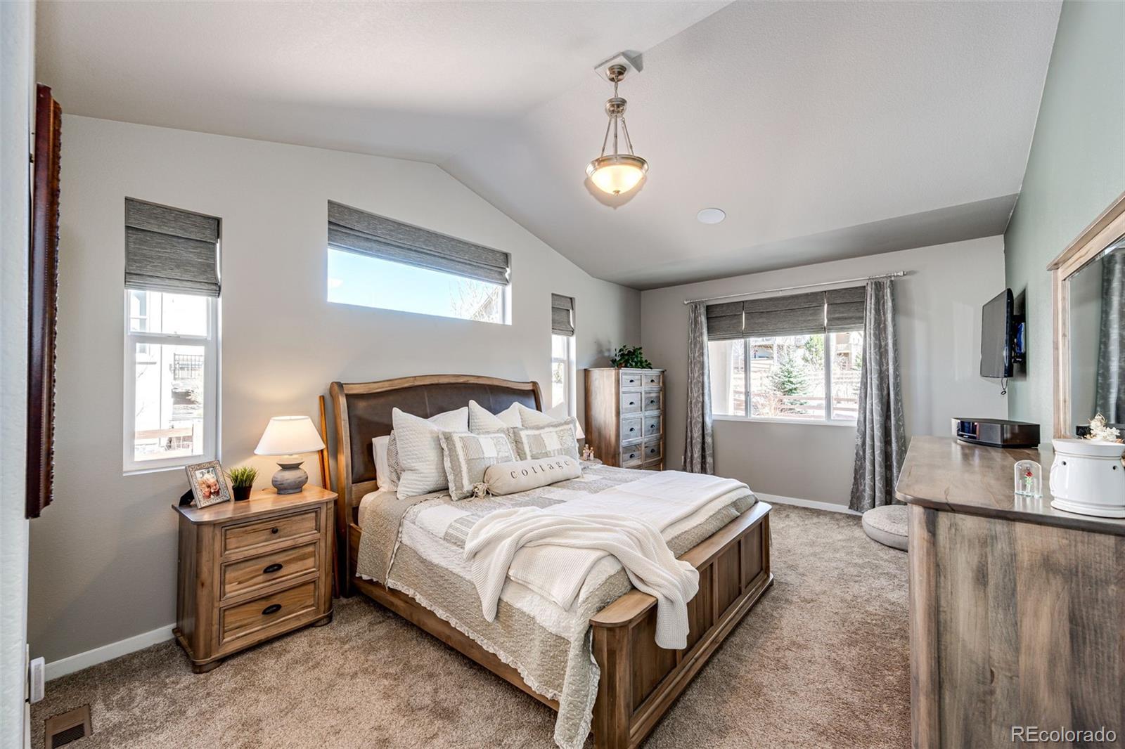 1951 Ruffino Drive Colorado Springs, CO 80921 - Photo 11 of 39 a bedroom with a bed and a night stand