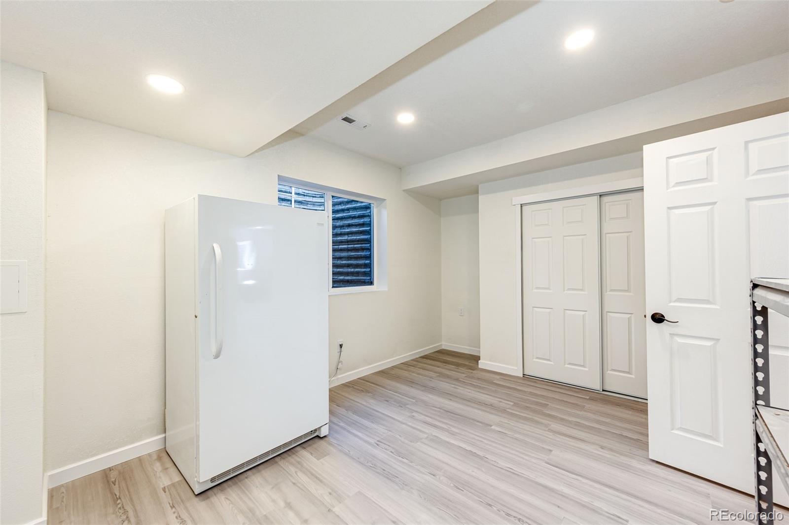 1951 Ruffino Drive Colorado Springs, CO 80921 - Photo 21 of 39 wooden floor in an empty room with wooden floor