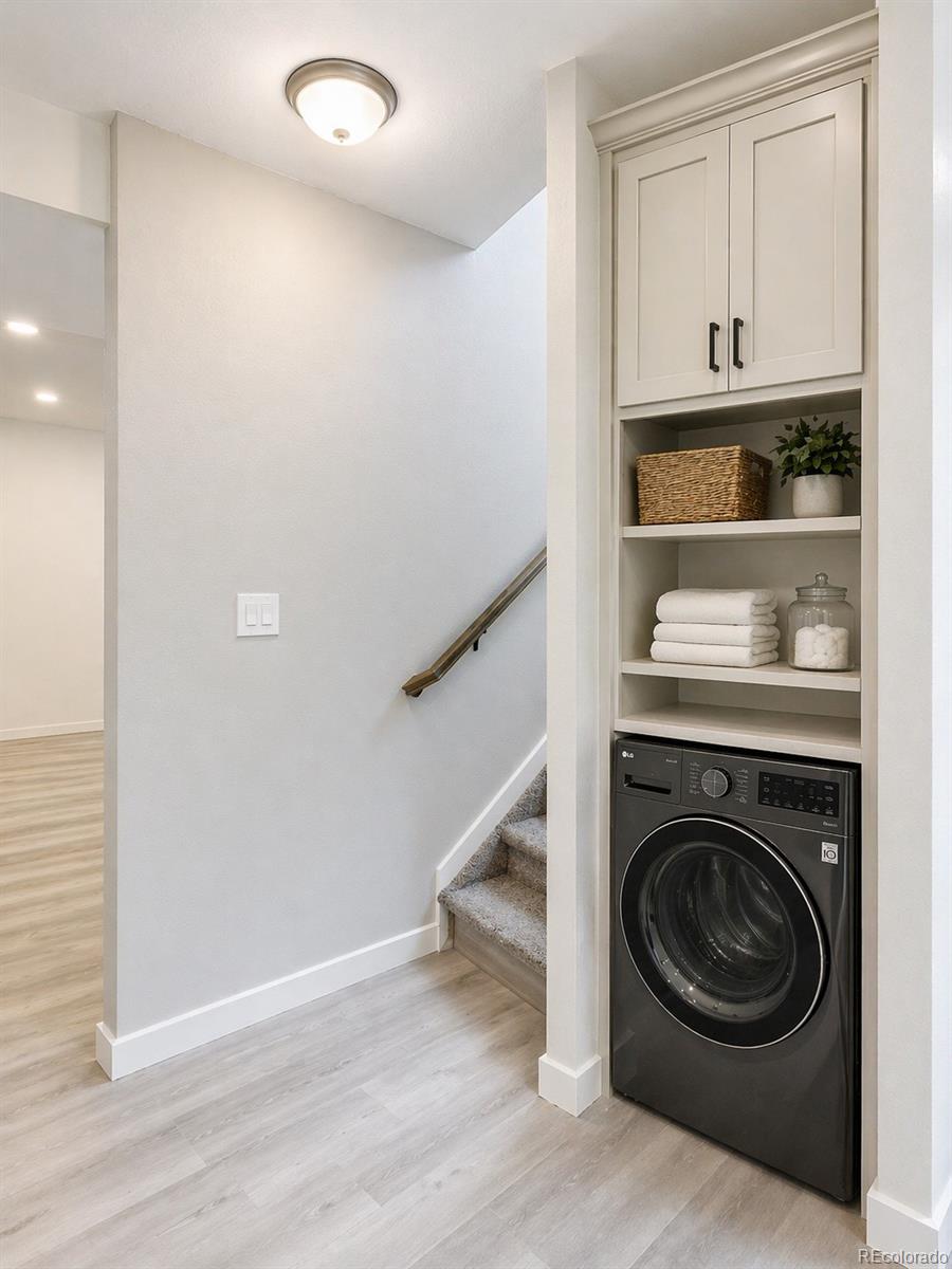 1951 Ruffino Drive Colorado Springs, CO 80921 - Photo 23 of 39 a utility room with wooden floor washer and dryer