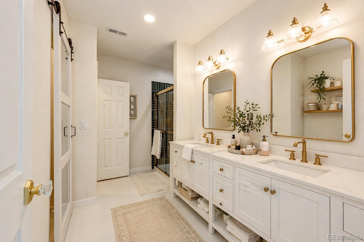 1951 Ruffino Drive Colorado Springs, CO 80921 - Photo 29 of 39 a spacious bathroom with double vanity a and a shower