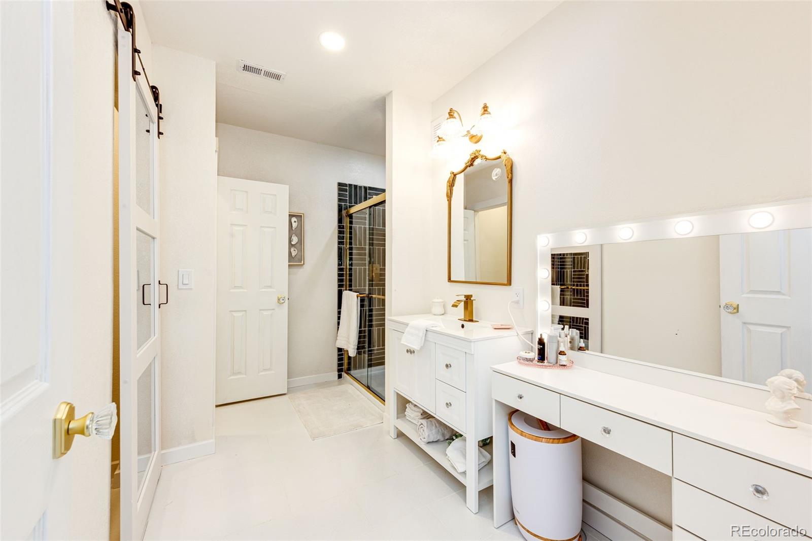 1951 Ruffino Drive Colorado Springs, CO 80921 - Photo 30 of 39 a spacious bathroom with a double vanity sink mirror and double