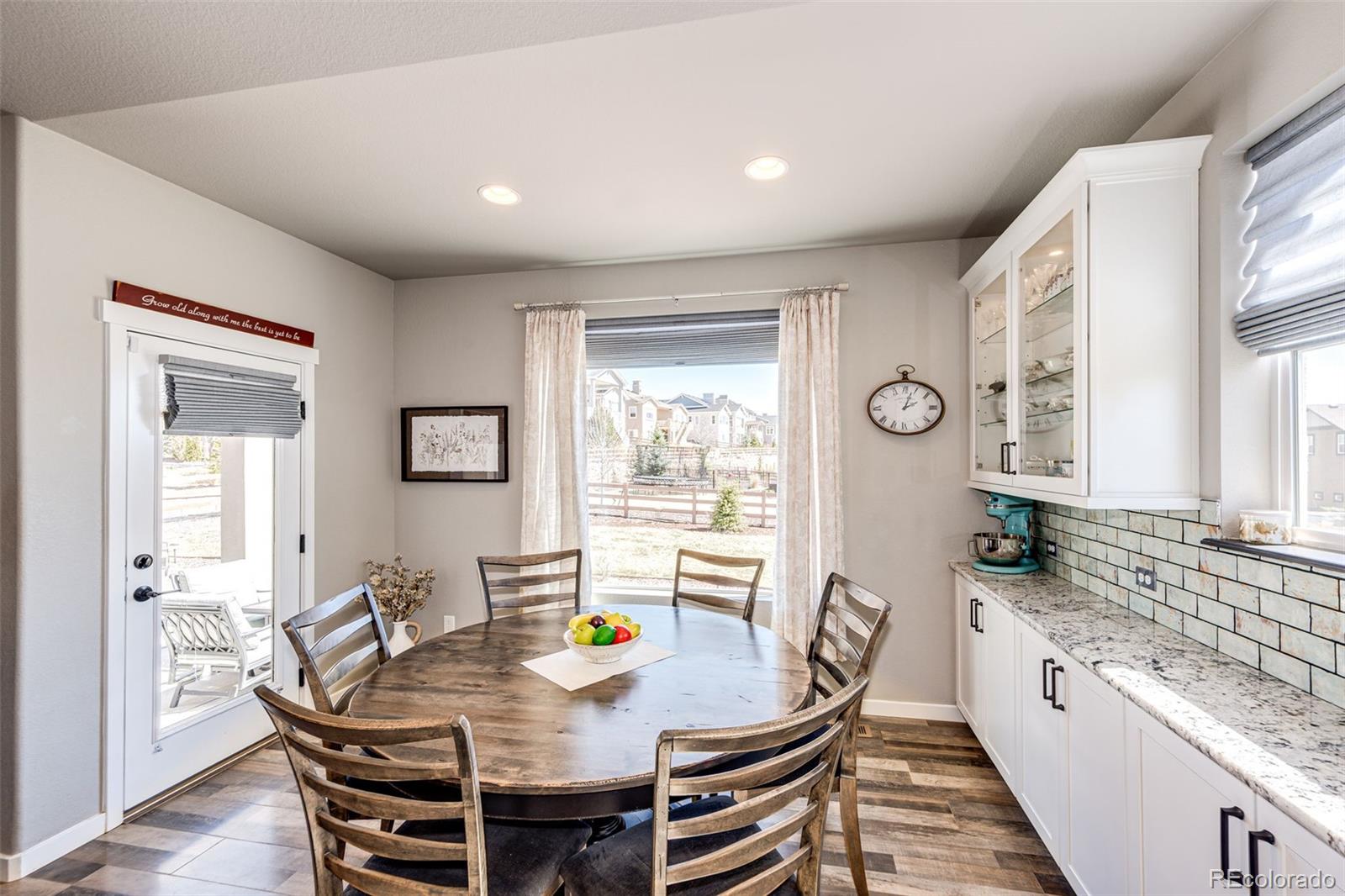 1951 Ruffino Drive Colorado Springs, CO 80921 - Photo 5 of 39 a view of a dining room with furniture and wooden floor