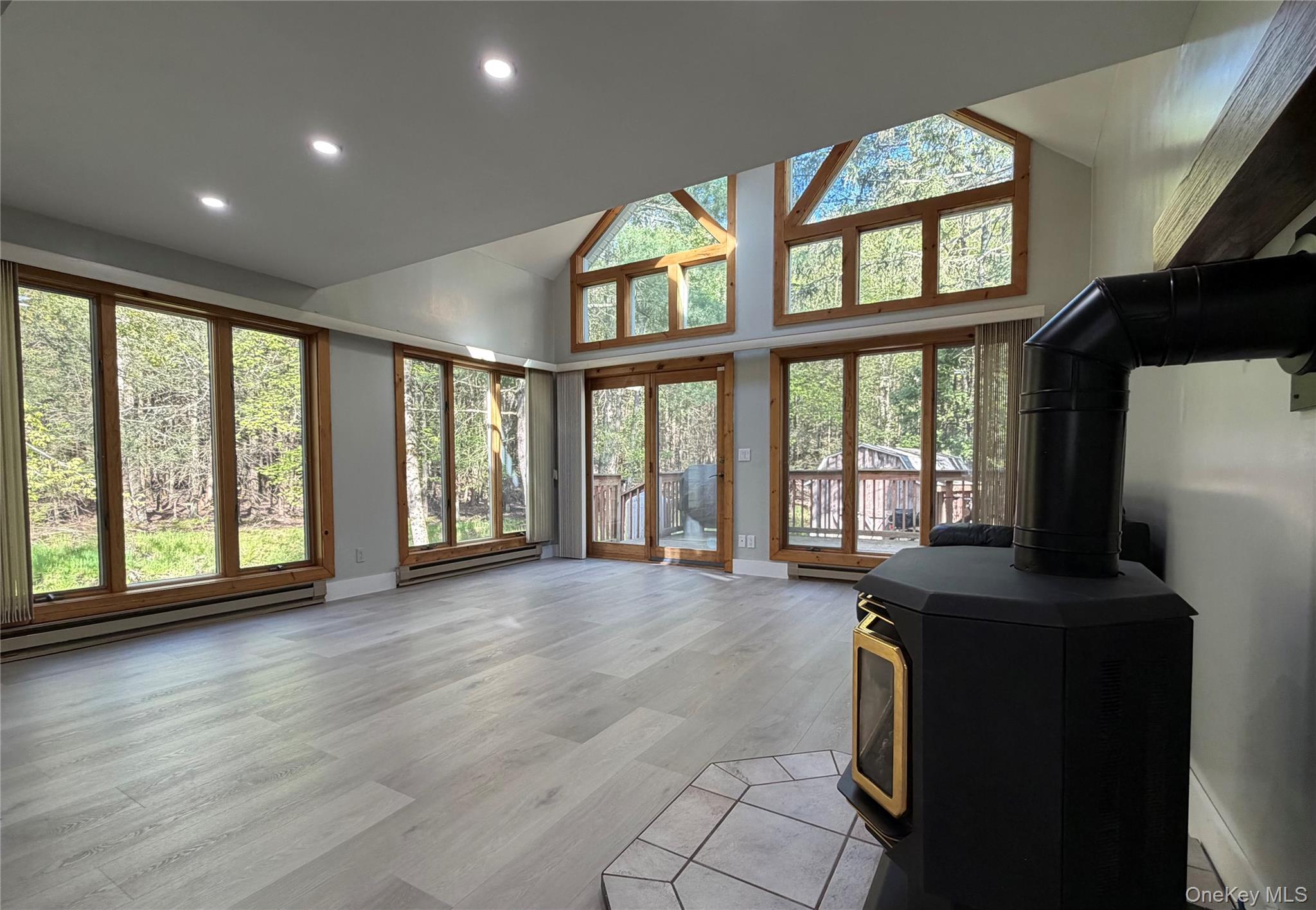 60 Medallion Road Kiamesha Lake, NY 12751 - Photo 4 of 44 a view of an empty room with a window and wooden floor