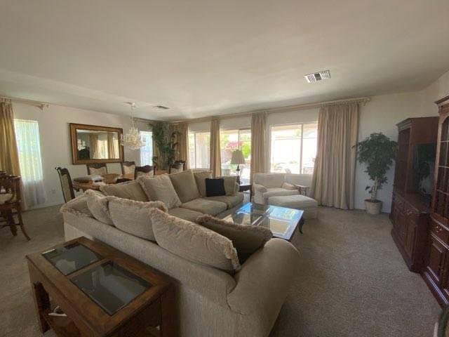 35201 Cornet Way Palm Desert, CA 92211 - Photo 12 of 35 a living room with furniture and a flat screen tv