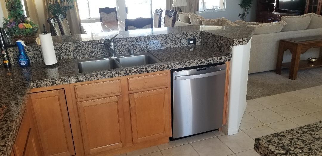 35201 Cornet Way Palm Desert, CA 92211 - Photo 13 of 35 a kitchen with stainless steel appliances granite countertop a sink and a refrigerator