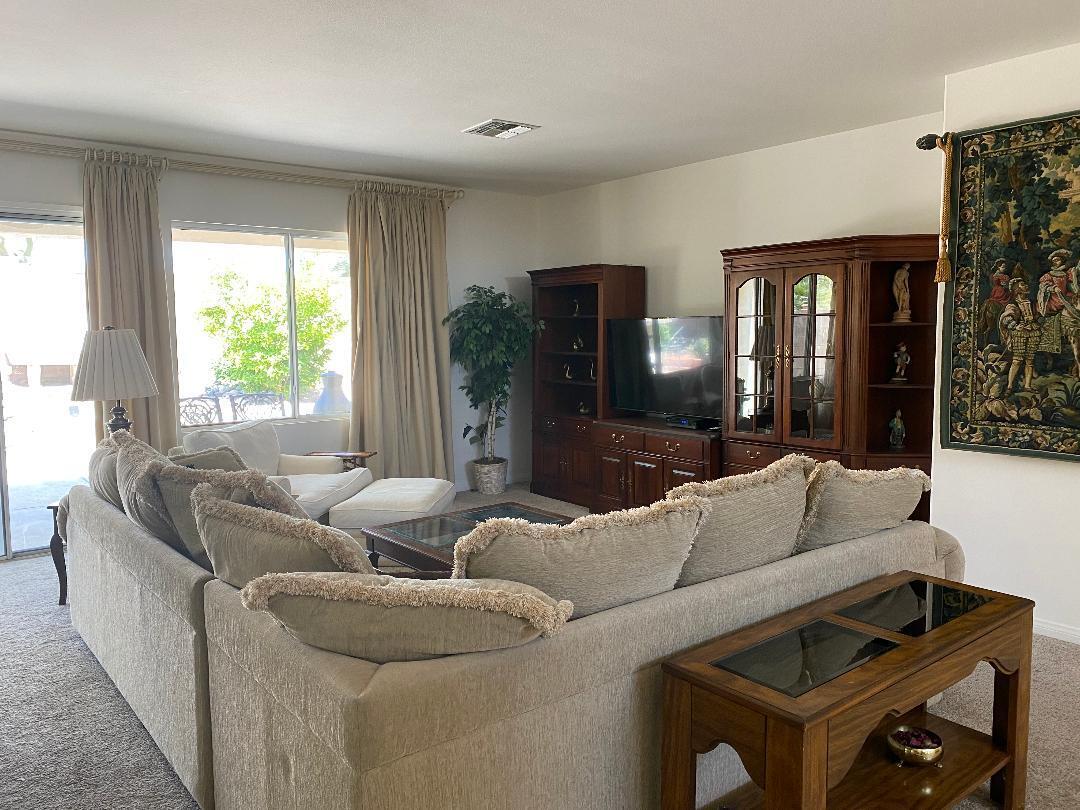 35201 Cornet Way Palm Desert, CA 92211 - Photo 20 of 35 a living room with furniture and a large window