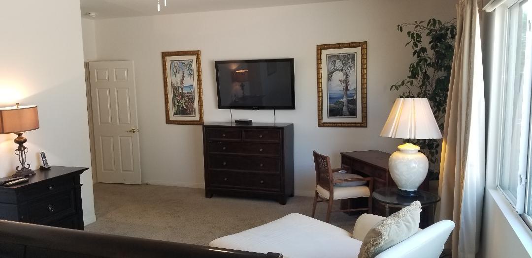 35201 Cornet Way Palm Desert, CA 92211 - Photo 24 of 35 a living room with furniture and a flat screen tv