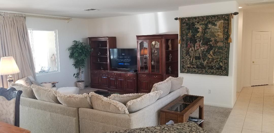 35201 Cornet Way Palm Desert, CA 92211 - Photo 27 of 35 a living room with furniture and a window