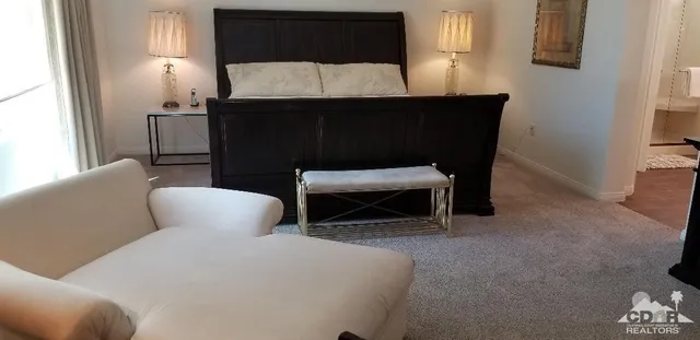 a living room with furniture a lamp and a fireplace