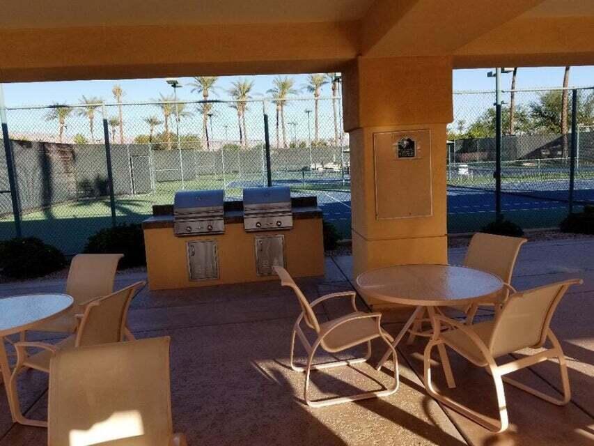 35201 Cornet Way Palm Desert, CA 92211 - Photo 32 of 35 a living room with patio furniture and a floor to ceiling window