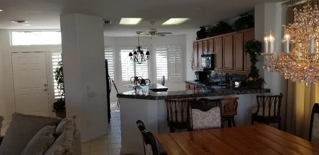 a kitchen with sink cabinets and wooden floor