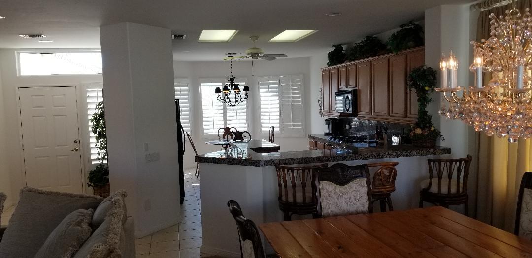 35201 Cornet Way Palm Desert, CA 92211 - Photo 7 of 35 a kitchen with sink cabinets and wooden floor