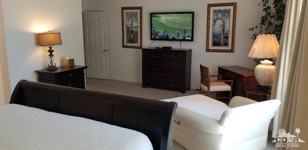 35201 Cornet Way Palm Desert, CA 92211 - Photo 9 of 35 a living room with furniture and a flat screen tv