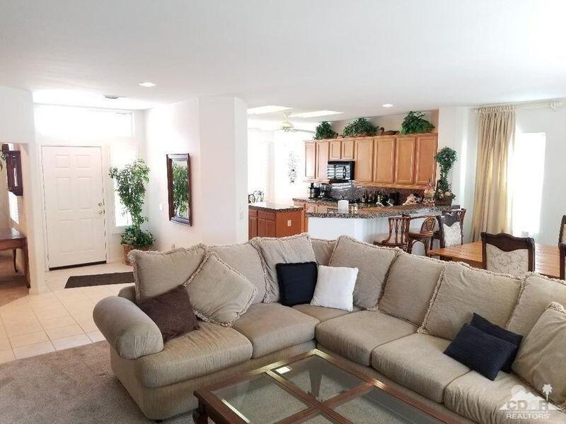 35201 Cornet Way Palm Desert, CA 92211 - Photo 10 of 35 a living room with furniture and a large window