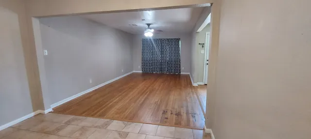 a kitchen with a sink a stove and cabinets