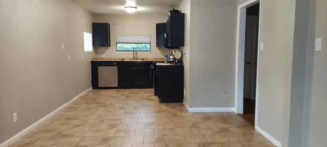 a view of a kitchen with a sink