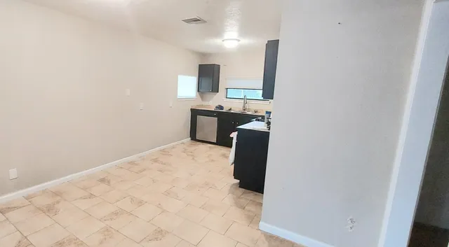 a view of a bathroom with wooden floor