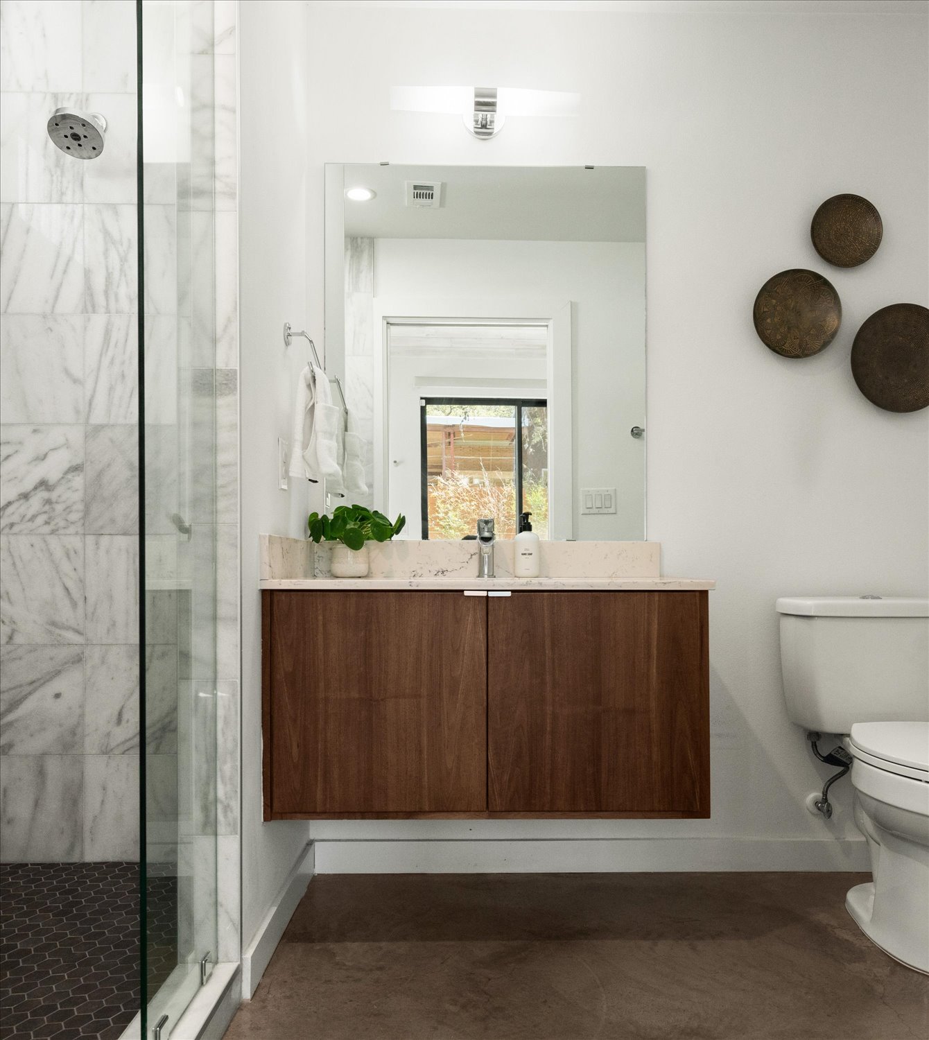 2214 South 3rd Street, Unit B Austin, TX 78704 - Photo 13 of 21 The bathrooms feature modern fixtures and a clean contemporary design.