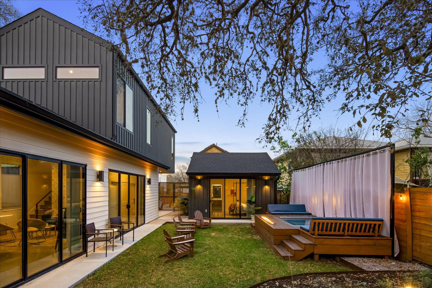 2214 South 3rd Street, Unit B Austin, TX 78704 - Photo 16 of 21 The backyard offers a private outdoor retreat beneath a beautiful mature oak tree.