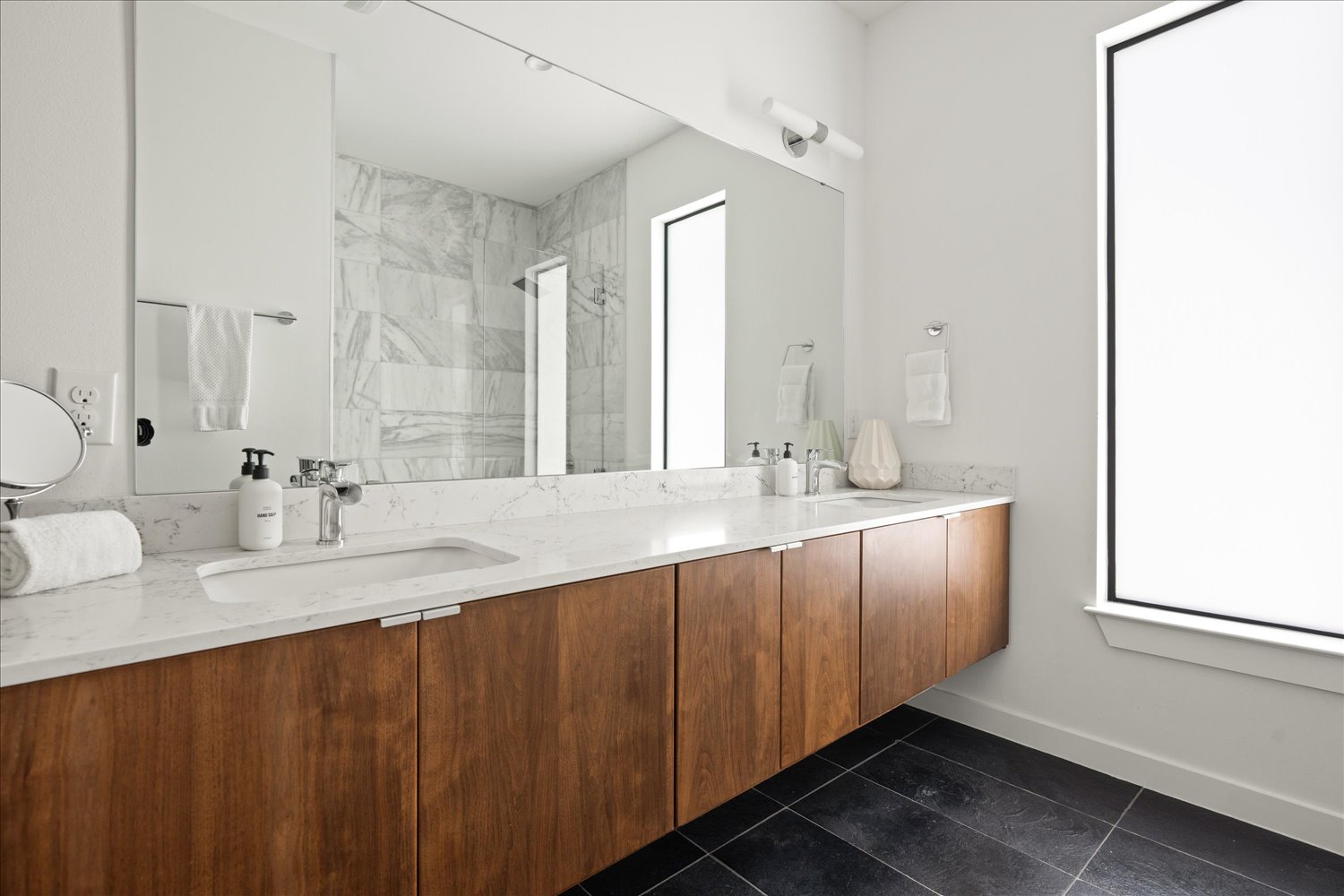 2214 South 3rd Street, Unit B Austin, TX 78704 - Photo 7 of 21 The primary bath offers a relaxing space designed for comfort and style.