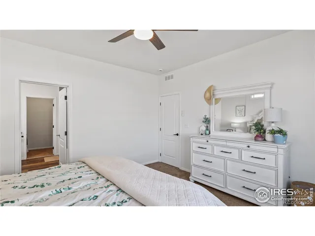 a room with a bed and cabinets