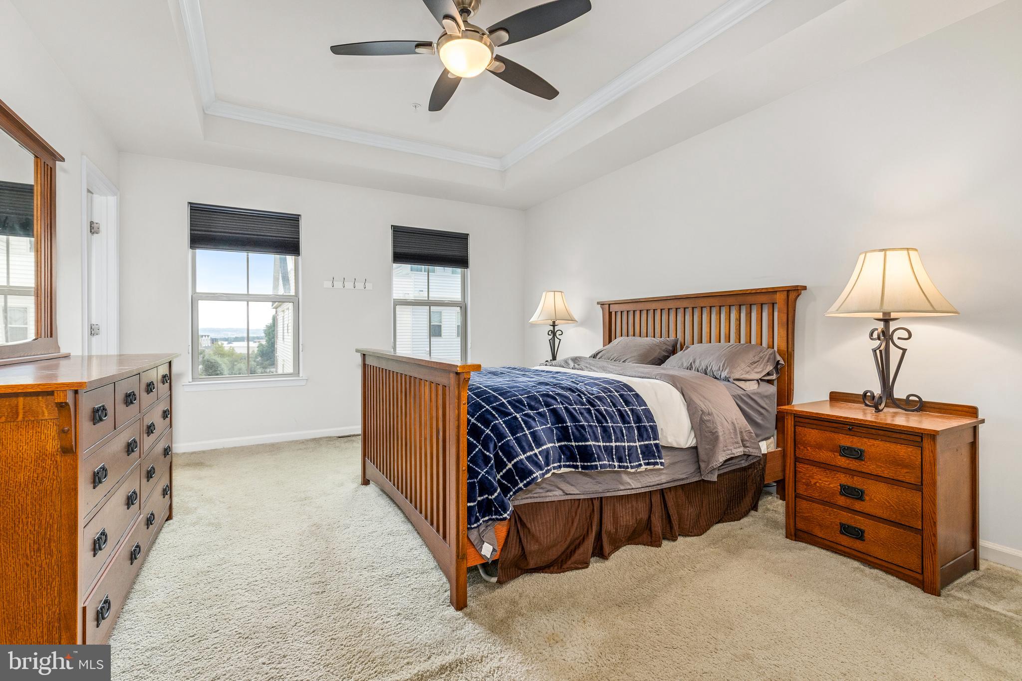 3629 Jamison Street Northeast Washington, DC 20018 - Photo 18 of 30 a bedroom with a bed and a chandelier